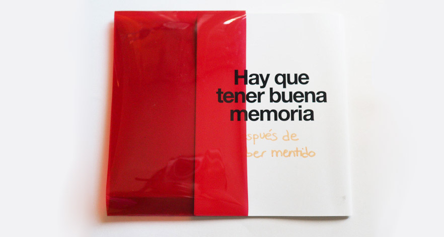 Memiento magazine cover with a red acetate which hides content.
